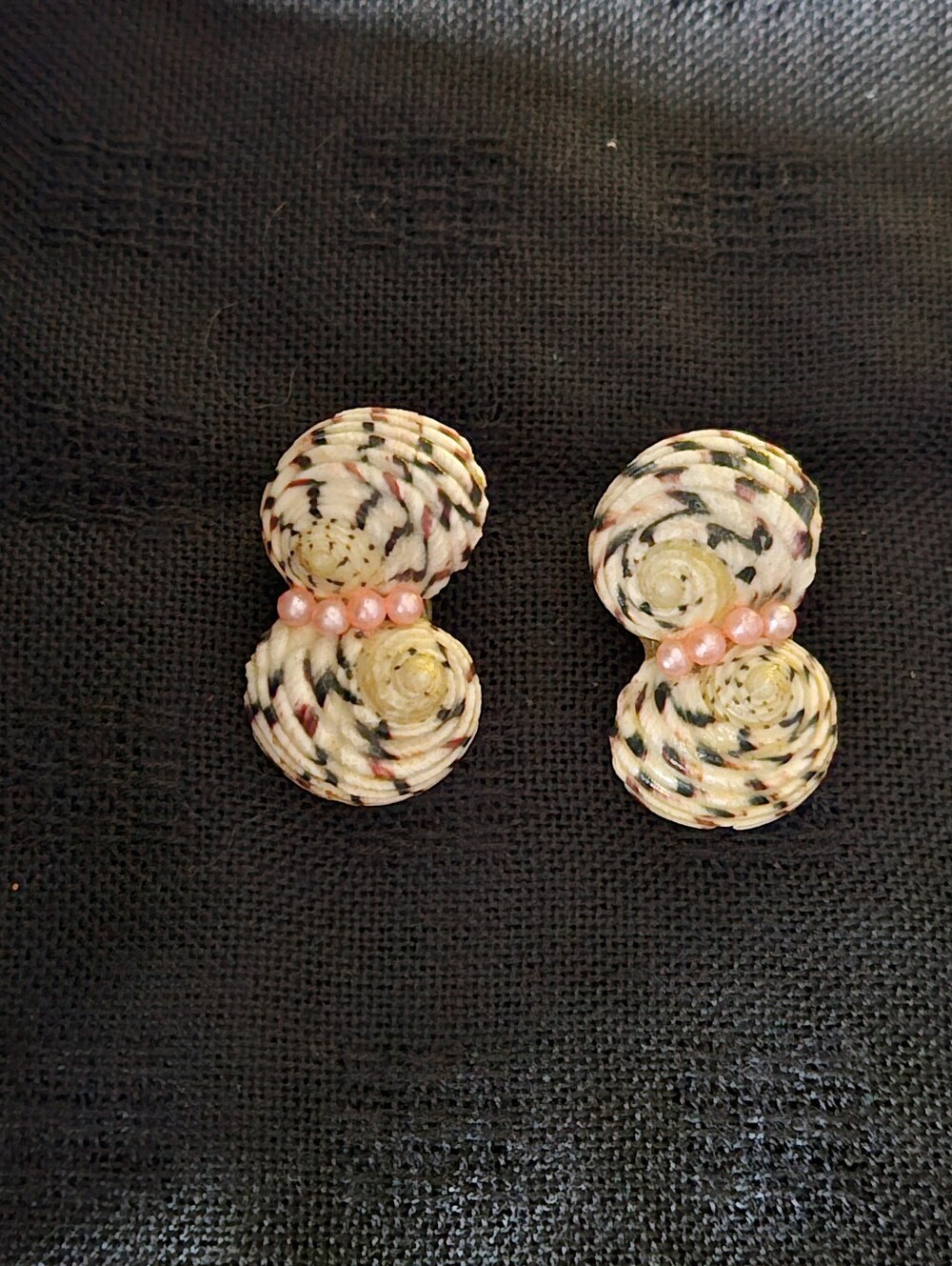 Spiral Seashells With Speckled Patterns Accented With Rows of Tiny Pink Beads